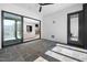 Bright screened porch with slate flooring, sliding glass doors, and access to outdoor seating at 604 Edmund St, Raleigh, NC 27604
