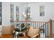 Open sitting area with large windows and decorative lighting fixtures at 604 Edmund St, Raleigh, NC 27604