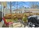 Cozy back deck with charming potted plants, outdoor seating, and a grill, perfect for relaxing at 605 Wyndham Dr, Fuquay Varina, NC 27526
