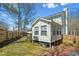 Inviting backyard featuring a screened-in porch and yard with shade, perfect for relaxing outdoors at 605 Wyndham Dr, Fuquay Varina, NC 27526