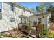 Two-story home featuring a spacious deck and views of the backyard space, perfect for relaxation at 605 Wyndham Dr, Fuquay Varina, NC 27526