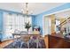 Elegant dining room featuring hardwood floors, a chandelier, and a bright window at 605 Wyndham Dr, Fuquay Varina, NC 27526