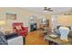 Cozy living room featuring hardwood floors, a fireplace, and comfortable seating at 605 Wyndham Dr, Fuquay Varina, NC 27526