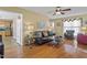 Inviting living room featuring hardwood floors, stylish furniture, and great natural light at 605 Wyndham Dr, Fuquay Varina, NC 27526