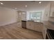 Open concept kitchen with granite countertops and stainless steel appliances offers modern design at 6405 Granite Quarry Dr, Raleigh, NC 27610