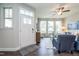 Inviting living area with natural light, a ceiling fan, and a comfortable seating arrangement at 6405 Granite Quarry Dr, Raleigh, NC 27610
