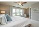 Bright main bedroom with large windows, neutral walls, and a comfortable seating area at 6405 Granite Quarry Dr, Raleigh, NC 27610