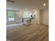Bright kitchen featuring white cabinets, stainless steel appliances, and a center island at 6407 Granite Quarry Dr, Raleigh, NC 27610