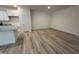 Spacious living area featuring hardwood floors, neutral walls, and natural light at 6407 Granite Quarry Dr, Raleigh, NC 27610
