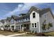 New townhomes boast multiple stories, large windows, modern siding and well-maintained lawns at 6411 Granite Quarry Dr, Raleigh, NC 27610