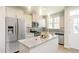 Modern kitchen features stainless steel appliances, granite countertops, and ample cabinet space at 6411 Granite Quarry Dr, Raleigh, NC 27610
