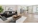 Inviting living room with hardwood floors, neutral color scheme and an open floor plan to kitchen at 6411 Granite Quarry Dr, Raleigh, NC 27610