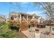 Beautiful backyard featuring a large deck, brick patio, and seating areas with outdoor dining at 711 S East Street St, Raleigh, NC 27601