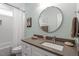 Bright bathroom featuring modern vanity, sleek fixtures, and a shower with a decorative mirror, offering a clean space at 711 S East Street St, Raleigh, NC 27601
