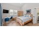 Bright bedroom featuring hardwood floors, light walls, and ample natural light from the window at 711 S East Street St, Raleigh, NC 27601