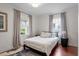 Serene bedroom with natural light, wood floors, and simple decor creating a cozy and restful atmosphere at 711 S East Street St, Raleigh, NC 27601