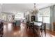 Bright dining room featuring wood floors, a modern chandelier, and lots of natural light at 711 S East Street St, Raleigh, NC 27601