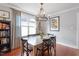 A dining room with hardwood floors, modern decor, and a chandelier at 711 S East Street St, Raleigh, NC 27601