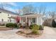 Charming home featuring a landscaped front yard, welcoming front porch and a driveway, offering classic appeal at 711 S East Street St, Raleigh, NC 27601