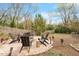 Backyard firepit area with Adirondack chairs, perfect for outdoor gatherings and relaxation at 711 S East Street St, Raleigh, NC 27601