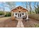 Charming guesthouse with a cozy porch swing, outdoor seating, and a well-manicured yard at 711 S East Street St, Raleigh, NC 27601