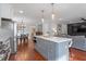 A kitchen island is conveniently situated between the kitchen, dining, and living room areas at 711 S East Street St, Raleigh, NC 27601
