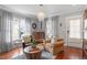Bright living room featuring hardwood floors, comfortable seating, and ample natural light, perfect for relaxation at 711 S East Street St, Raleigh, NC 27601