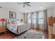 A main bedroom featuring hardwood floors, neutral decor, and plenty of natural light at 711 S East Street St, Raleigh, NC 27601