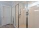 Clean shower with white subway tile, glass enclosure, and door to another part of the bathroom at 711 S East Street St, Raleigh, NC 27601