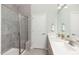 Modern bathroom with a glass-enclosed shower, dual sinks, and elegant fixtures at 720 Ben Ledi Ct, Raleigh, NC 27603
