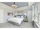 Serene main bedroom with a tray ceiling, soft lighting, and modern decor at 720 Ben Ledi Ct, Raleigh, NC 27603