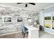 Well-lit home office with a modern desk, decorative wall paneling, and a calming color palette at 720 Ben Ledi Ct, Raleigh, NC 27603