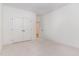 Spacious, carpeted bedroom featuring closet, and a glimpse into the hall, providing a versatile space at 724 Red Arrow Dr, Knightdale, NC 27545