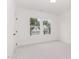 Bright bedroom with window view of adjacent home and lush green trees at 724 Red Arrow Dr, Knightdale, NC 27545