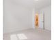 Bright bedroom with neutral carpet and an open door to the bathroom at 724 Red Arrow Dr, Knightdale, NC 27545