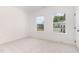 Bedroom with two windows bringing in natural light and views of neighboring houses at 724 Red Arrow Dr, Knightdale, NC 27545