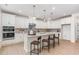 Well-lit kitchen featuring pendant lighting, an island with seating, and ample cabinet space at 724 Red Arrow Dr, Knightdale, NC 27545