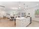 Open concept kitchen featuring an island with pendant lighting and view of dining and living area at 724 Red Arrow Dr, Knightdale, NC 27545