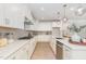 Stylish kitchen with gas range, light countertops, and stainless steel appliances, blending functionality with modern aesthetics at 724 Red Arrow Dr, Knightdale, NC 27545