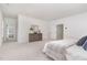 Spacious primary bedroom with serene bathroom view, neutral palette, and plush carpet at 724 Red Arrow Dr, Knightdale, NC 27545