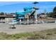 Community swimming pool with waterslide, seating, and view of nearby houses at 724 Red Arrow Dr, Knightdale, NC 27545