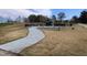 Community splash pad surrounded by a green space with trees and walking trail at 724 Red Arrow Dr, Knightdale, NC 27545