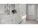 A stylish primary bathroom with double sinks, white cabinets, and modern fixtures at 752 Ben Ledi Ct, Raleigh, NC 27603