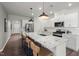 A gourmet kitchen featuring a large center island with bar seating and modern stainless-steel appliances at 752 Ben Ledi Ct, Raleigh, NC 27603