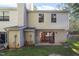 Back exterior of home with a sliding glass door and a small backyard at 7820 Falcon Rest Cir, Raleigh, NC 27615