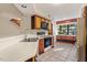 Bright kitchen features wood cabinets, modern appliances, and a large window with backyard views at 7820 Falcon Rest Cir, Raleigh, NC 27615