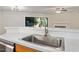 Kitchen sink with stainless steel faucet and solid surface countertops at 7820 Falcon Rest Cir, Raleigh, NC 27615