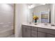 Clean bathroom features a double sink vanity and a shower and bathtub with white tile surround at 800 Emerald Bay Cir, Raleigh, NC 27610