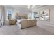 Bright bedroom with a large bed, modern art, and a stylish chandelier at 800 Emerald Bay Cir, Raleigh, NC 27610