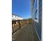 Long wooden balcony with railings overlooking the street and new construction at 804 Hillfarm Dr, Wake Forest, NC 27587